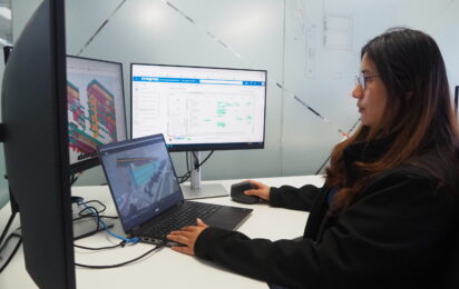 Atec Digital Engineering Analyst Pia Nithi reviews façade design and project management data across multiple screens using Autodesk Forma and digital engineering tools.