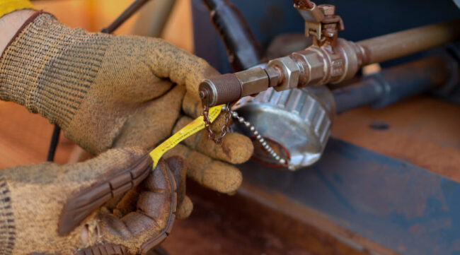 Technician carrying out electrical infrastructure upgrade works on critical industrial assets.